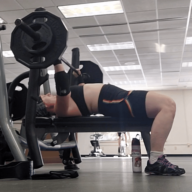 Edie bench pressing in the gym